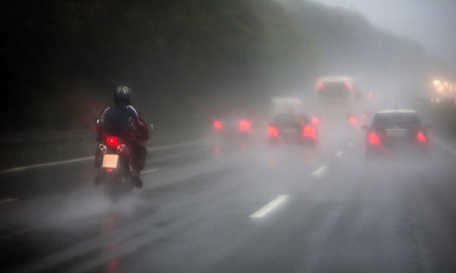 Motorcycle riding in rain