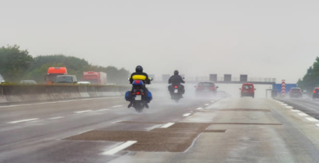 Motorcycle riding in rain